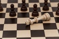 King in chess has fallen to several pawns Royalty Free Stock Photo