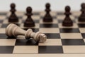 King in chess has fallen to several pawns Royalty Free Stock Photo