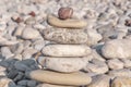 Several pebble stone on beach complex like symbol for zen