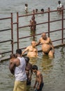 Several people bath ritually in Cauvery River.