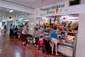 .Several people buy fruits and vegetables in the food galleries