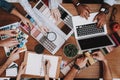 Several People. Desk. Vase and Notebook. Table.