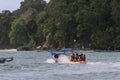 Several people are riding a banana boat on Pangandaran beach Royalty Free Stock Photo