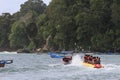 Several people are riding a banana boat on Pangandaran beach Royalty Free Stock Photo