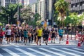 People running on Avenida Paulista