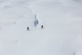 SEVERAL PEOPLE WALK ON MOUNTAIN.