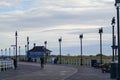 Several people walking on an uncrowded Atlantic City boardwalk