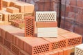 Several perforated bricks of different colors with round holes Royalty Free Stock Photo