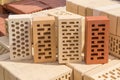 Perforated bricks of different colors and shapes of holes