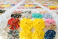 Several pieces of Fuxico sewn together forming a bedspread. craft.