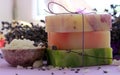 Several pieces of handmade soap with lavender and large crystals of sea salt