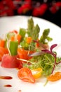 Several pieces of japanese sashimi on a plate