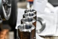 Several piled-up rusty nuts lie in the workshop