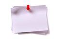 Several plain white sticky post notes with red pushpin cut out background Royalty Free Stock Photo