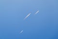 Several planes fly in the sky at the same time with trail Royalty Free Stock Photo
