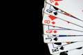 Several playing cards on a dark background c Royalty Free Stock Photo