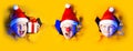 Several portraits little cheerful Santa in hat smiles, getting out of the ragged yellow background lit by neon light. Large size Royalty Free Stock Photo