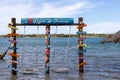 Several posters with words in Portuguese next to two hammocks in the Carcara lagoon