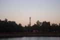 Several radio towers with sunset sky in background Royalty Free Stock Photo