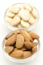Several raw almonds white background surrounded