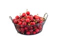 Several red cherries in a basket on a white background Royalty Free Stock Photo