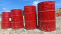 several red drums lined up on the ground Royalty Free Stock Photo