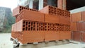 Several red perforated brick on pallet