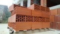 Several red perforated brick on pallet Royalty Free Stock Photo