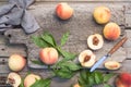 Several ripe juicy peaches on a wooden surface. Peach fruits on the wooden board. Green living. Organic food Royalty Free Stock Photo