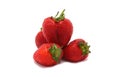 Several ripe strawberries on a light background.