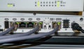 Several RJ45 LAN cables connected to wifi router formed communication network