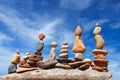 Several Rock zen pyramids of colorful pebbles on a beach on the background of the sea. Concept of balance, harmony and meditation Royalty Free Stock Photo