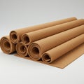 Several rolled-up sheets of cork, light brown and textured, are neatly stacked on a flat surface. Royalty Free Stock Photo
