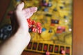 Several rolling red dice fall on a table with boardgame. Gameplay moments Royalty Free Stock Photo