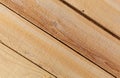 Several rough sawn lumber boards at an angle