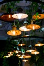 Several round loft style suspended luminaires with edison lamps shine a warm light.