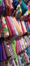 Several rows of fabrics in various colors and motifs Royalty Free Stock Photo