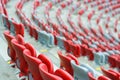 Several rows of red and white stadium seats