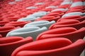 Several rows of red and white stadium seats