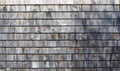 Several rows of weathered gray cedar shingles in morning light wide view Royalty Free Stock Photo