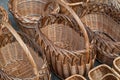 Several rows of wicker baskets. Baskets are woven from vines.