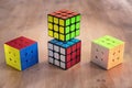 Madrid, Spain; 9 february 2019: Several Rubik cubes intelligence toys solved, in a wood table