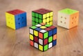 Budapest, Hungary; 9 february 2019: Several Rubik cubes intelligence toys unsolved, in a wood table