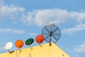 Several satellite dish installed on the house roof with blue sky Royalty Free Stock Photo