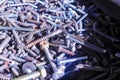 Several screws piled up in the workshop Royalty Free Stock Photo