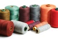 Several sewing spools of various color on white background, isolated