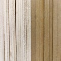Several sheets of new clean plywood in a stack. Sale of goods for repair and decoration. Wood and texture. Abstract background and Royalty Free Stock Photo