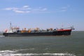 several ships loading and unloading in the Harbor of Rotterdam, the Netherlands.