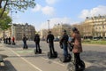 Several sightseers taking a tour through the city on motorized scooters,Paris, France,2016