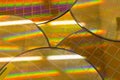 Several Silicon Wafers with microchips - A wafer is a thin slice of semiconductor material, such as a crystalline silicon, used in